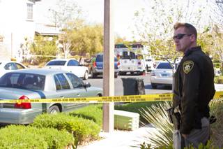 Police investigate the scene of a shooting where a Summerlin resident shot and killed an intruder in his backyard, Tuesday, March 20, 2012.